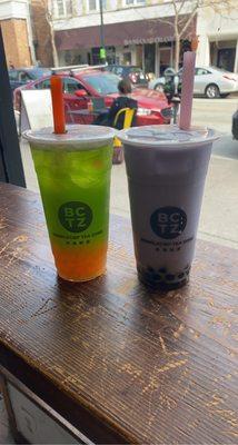 Green apple tea with strawberry popping pearls, taro milk tea with boba