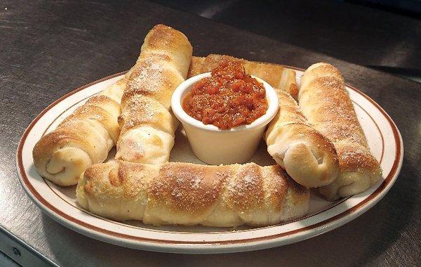 Thin rolled Pizza Dough filled with Mozzarella and Pepperoni make up our Rocket Rolls