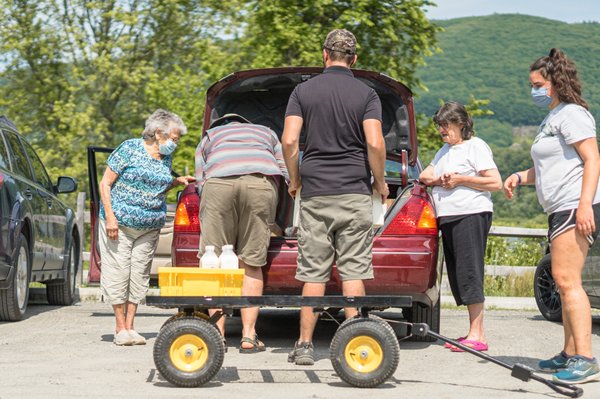 Loading a car with our first free Farm Share of the season