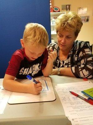 Lorrie with one of the many students of varying ages served at ETC.