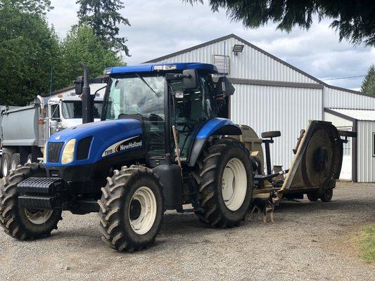 Preparing the brush hog to go mow some fields.