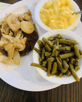 Chopped steak with grilled onions, green beans and Mac and cheese.