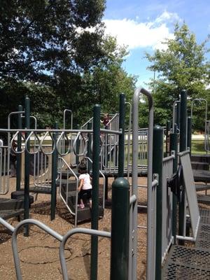 Fia and her new friend playing on the play set