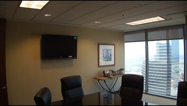 TV installed on wall in a high rise Dallas boardroom