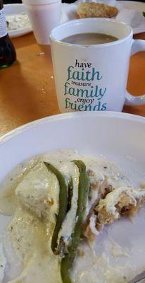 Half eaten sweet tamale with coffee.