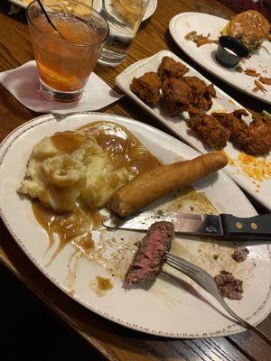 Sirloin mashed potatoes bread stick and old fashioned