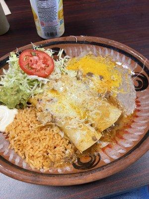 Chicken. Enchiladas with rice and beans.