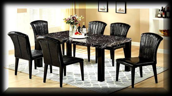 A very Nice Looking, Marbelized Table w/Strong Foundation and Comfy 6-High Back Chairs.  You Cant Beat This Deal.  Call Me Now For Best Deal