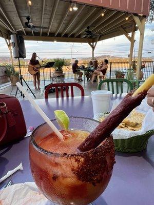 Meghan Oberle singing live and my tamarind Tajín margarita with chamoy.