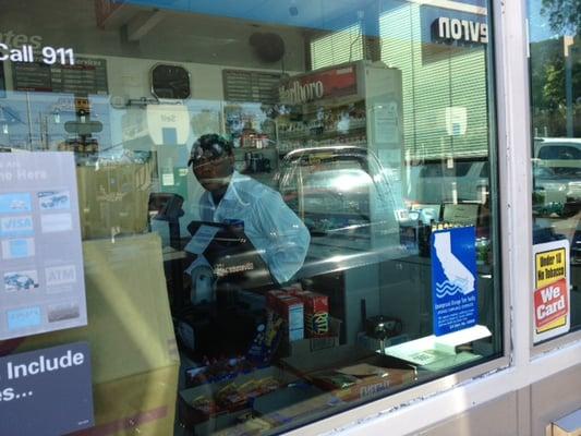 This Chevron employee doesn't care if you get harassed by homeless people at his gas station. He should be replaced.