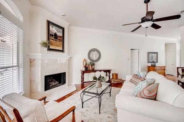 A warm and inviting living room staged using the clients own furnishings.