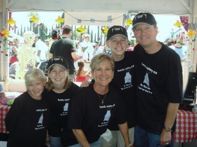 Dr. Steven Altman and family serving chili at the Tustin Chili Cookoff, 2009.