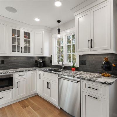 Grey Mist granite  with an under-mount sink, Hansgrohe talis pull down spray faucet and a stainless steel Thermador dishwasher