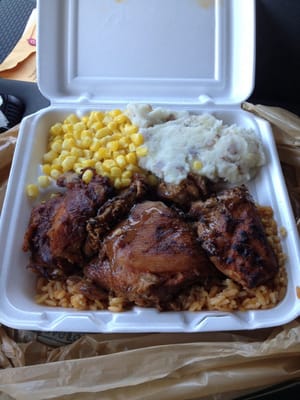 Great chicken on a bed if rice with to sides and dessert