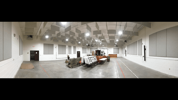 Wall and ceiling acoustic treatment in a gymnasium space for amazing sound.