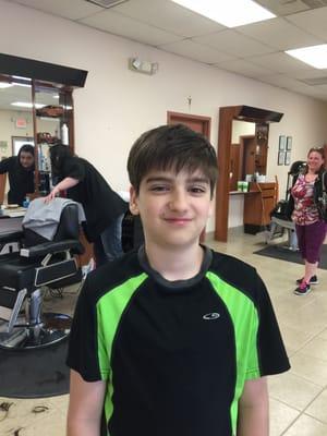 Spencer, one of our awesome kids with his new haircut. Looking good kid!!!