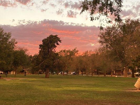 Beautiful sunset over the park after a rainy evening.