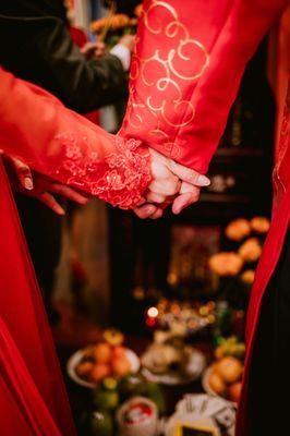 The detailing of the grooms and brides outfit