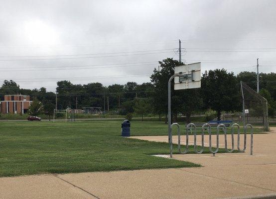 A football field, ball field, and half basketball courts are part of the sports amenities.