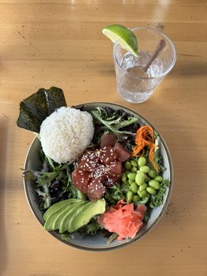 TUNA POKÉ sushi grade tuna in a garlic, ginger, soy and sesame sauce, with cucumber water brined carrots, ginger, avocado, nori, sushi rice