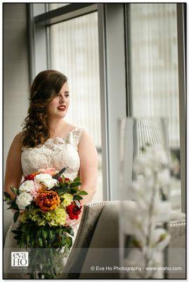 Bride looking out the window just before walking down the aisle.