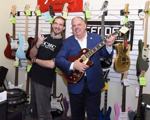 Maryland Governor Larry Hogan strums along at Western MD Music Center.