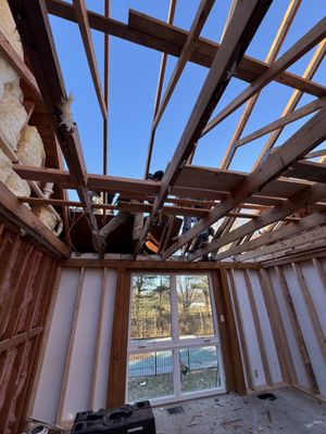 removing a truss framed roof & framing out a ridge with roof rafters so the home owner can have a cathedral ceiling