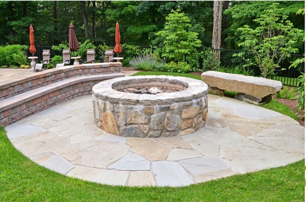 Reimagine your outdoor living space with us! This patio & fire pit with ample seating is a great addition.