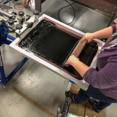 Grace printing some black ink for a customer.