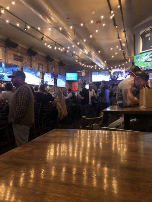 View of packed bar from raised table.