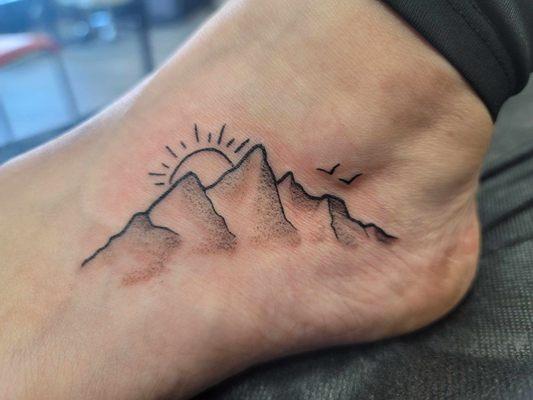 My simple line tatoo of a mountain on my foot