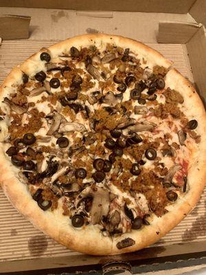 Vegan custom pizza w/ Field Roast sausage, garlic, black olives, mushrooms, & vegan cheese