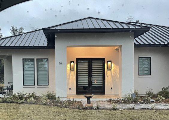 Shutters with banded shades on the doors