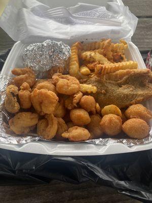 1 piece Trout & Shrimp with hush puppies, fries & honey butter corn.