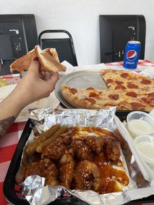 Boneless wings with Asian zing dipping sauce... pepperoni pizza with crispy crust, fried zucchini.