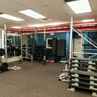 Functional training space including boxing bags, suspension systems, battle ropes, kettle bells, resistance bands, barbells and plyo boxes