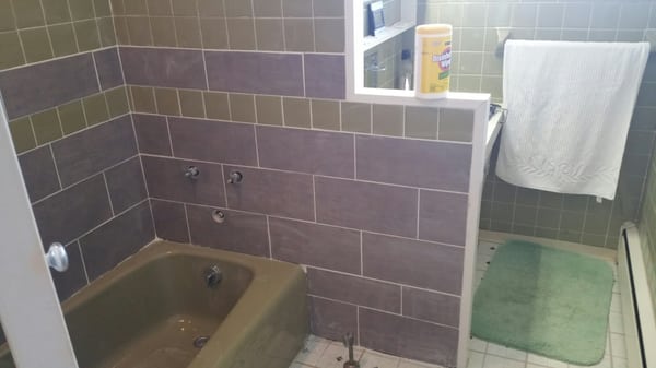 Tile repair along tub