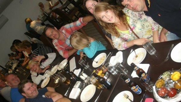 Enjoying friends and family between tapas style courses at an authentic Indian restaurant