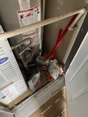 Flammable materials kept right next to water heater and gasappliances. Found on move in.