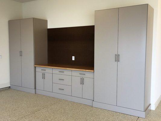 Garage Cabinets with pegboard and workbench