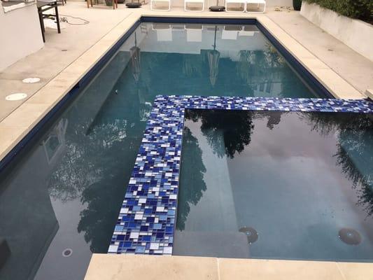 Studio city pool and spa combo. St. Martins quartz interior finish with glass tiles from Austria.