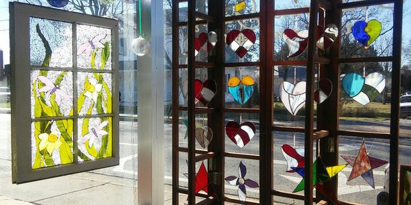 Beautiful mosaic glass panels and stained glass sun catchers by Cow Dog Designs NC are available at Southwinds Gallery.