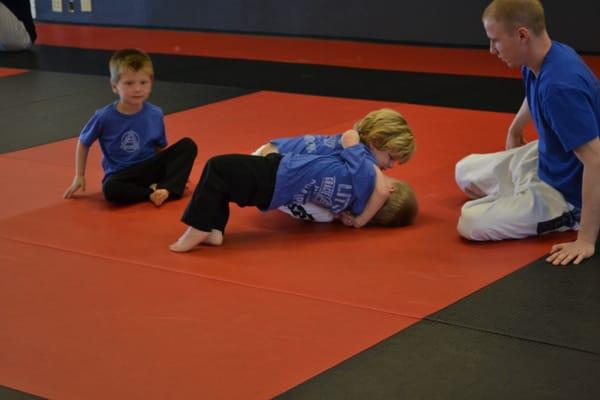 A couple of our "Little Champions" practicing some grappling.