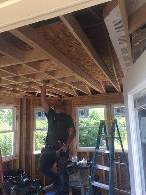 One of our crews wiring a new sunroom addition and installing a ring camera flood light. Give us a call if you plan on adding to your home.