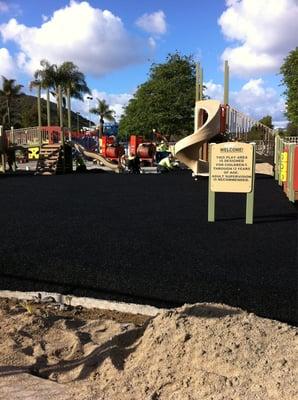 crew installed new features & laying down new ground cover material