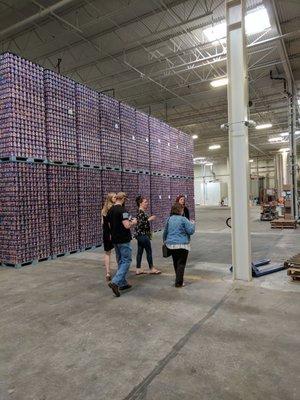 A wall of cans at Oskar Blues Brewery on Charlotte's private brewery tour