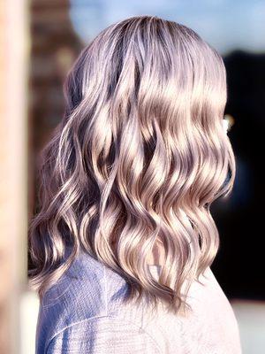 Platinum blonde foils with an icy cool toner. Trimmed the ends. This photo was taken at sunset.