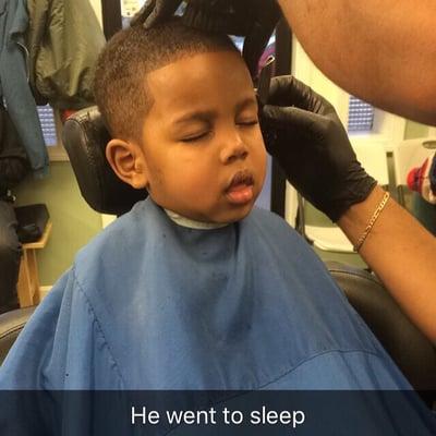 My 3 year olds first hair cut. He was so comfortable he fell asleep!