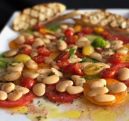 Marinated gigantes beans, tomato salad, grilled baguette