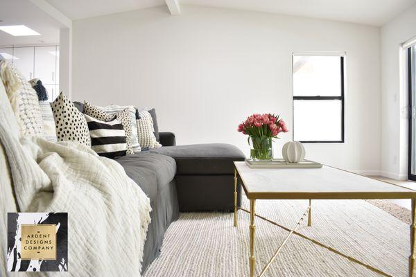 Neutral and textured living room with glam elements.